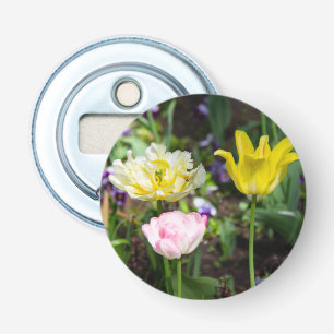 White, pink and yellow tulips in the garden bottle opener