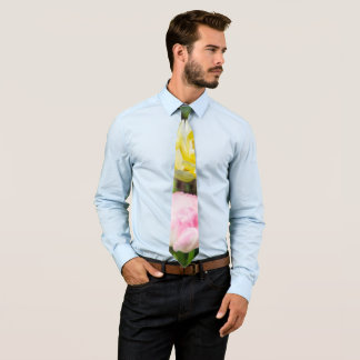 White, pink and yellow tulips in the garden     tie