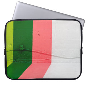 White, pink, green, and yellow painted wall laptop sleeve