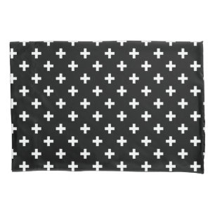White polka crosses on black pillowcase