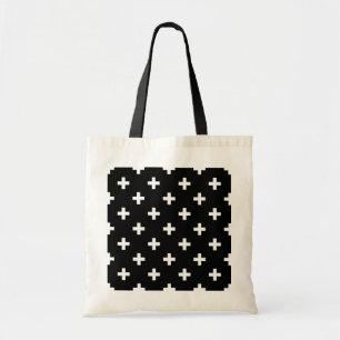 White polka crosses on black tote bag
