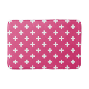 White polka crosses on fuchsia bath mat