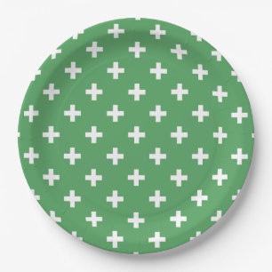White polka crosses on green paper plate