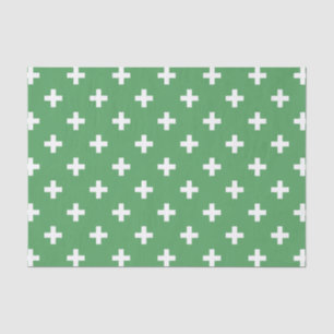 White polka crosses on green tissue paper