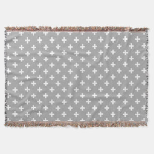 White polka crosses on grey throw blanket