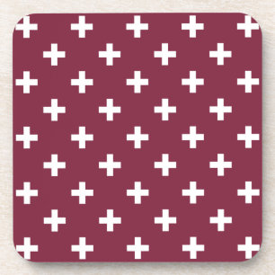 White polka crosses on mulberry coaster