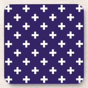 White polka crosses on navy blue coaster