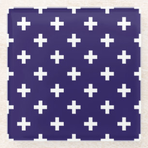 White polka crosses on navy blue glass coaster