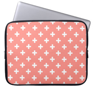 White polka crosses on peach laptop sleeve