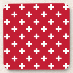 White polka crosses on red coaster