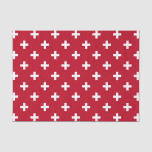 White polka crosses on red tissue paper