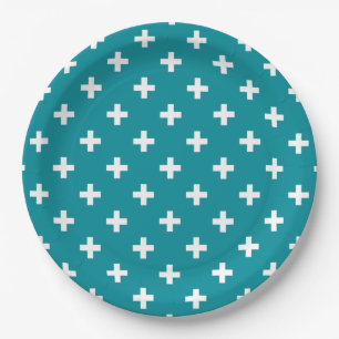 White polka crosses on teal paper plate