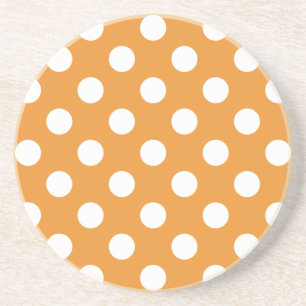 White polka dots on amber coaster