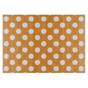 White polka dots on amber cutting board