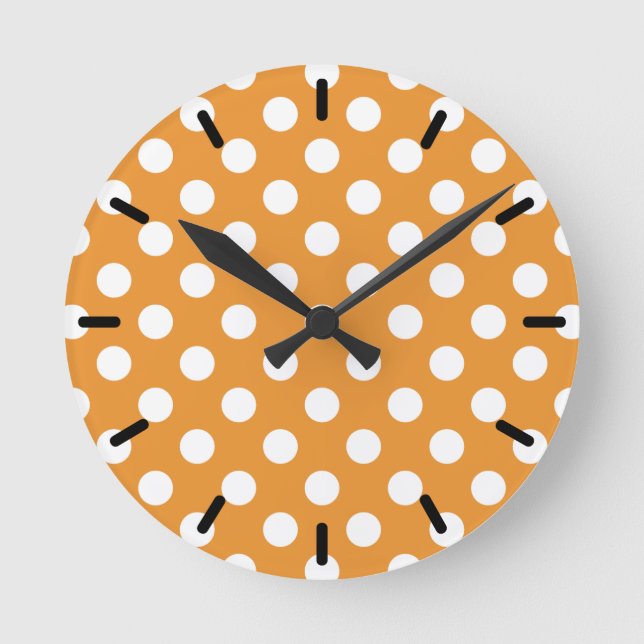 White polka dots on amber round clock (Front)