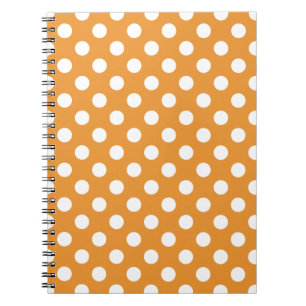 White polka dots on amber spiral notebook
