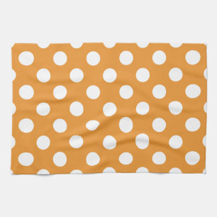 White polka dots on amber tea towel