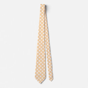 White polka dots on beige tie