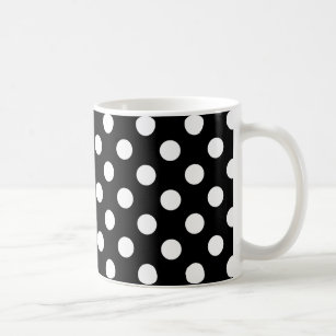 White polka dots on black coffee mug