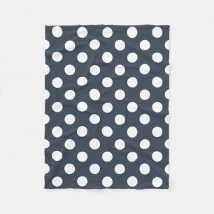 White polka dots on blue-grey fleece blanket