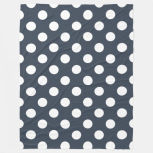 White polka dots on blue-grey fleece blanket
