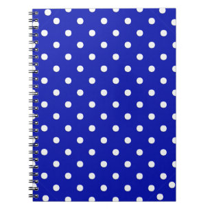 white polka dots on blue spiral notebook
