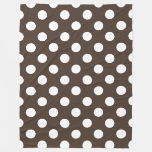 White polka dots on brown fleece blanket