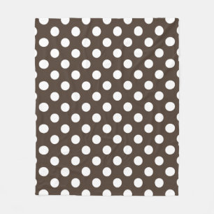 White polka dots on brown fleece blanket