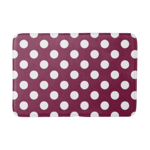 White polka dots on burgundy bath mat