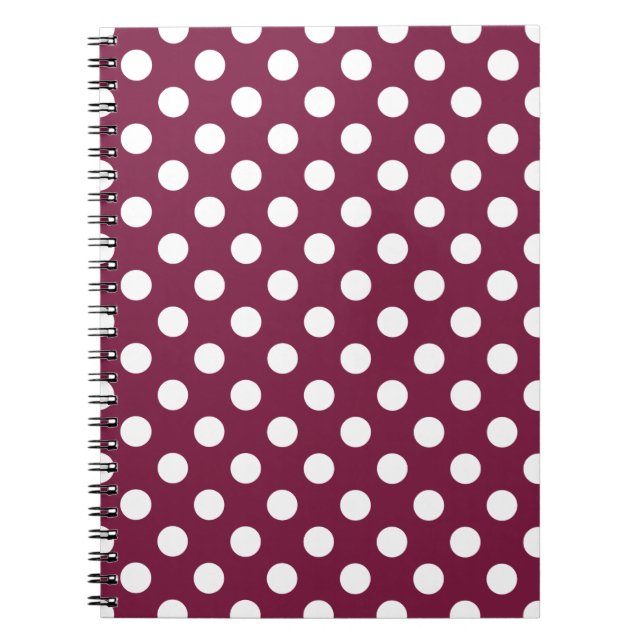 White polka dots on burgundy notebook (Front)