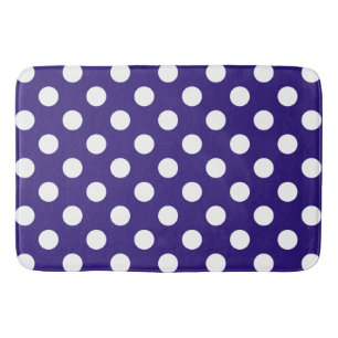 White polka dots on dark blue bath mat