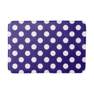 White polka dots on dark blue bath mat