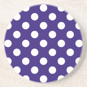 White polka dots on dark blue coaster