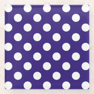 White polka dots on dark blue glass coaster