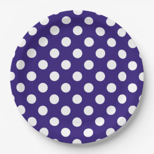 White polka dots on dark blue paper plate