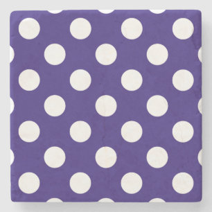 White polka dots on dark blue stone coaster