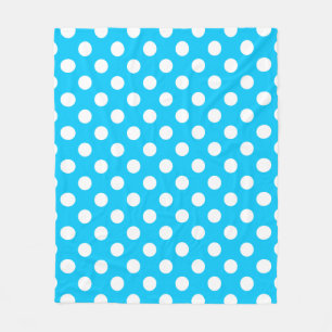White polka dots on electric blue fleece blanket