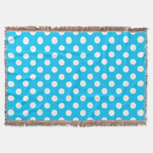 White polka dots on electric blue throw blanket