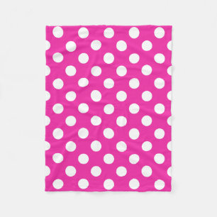 White polka dots on fuchsia fleece blanket