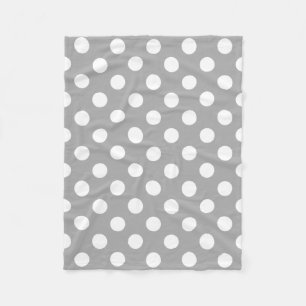 White polka dots on grey fleece blanket