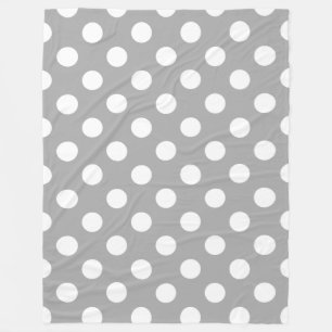 White polka dots on grey fleece blanket