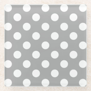 White polka dots on grey glass coaster