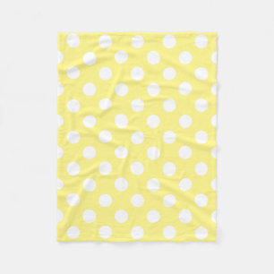 White polka dots on lemon yellow fleece blanket
