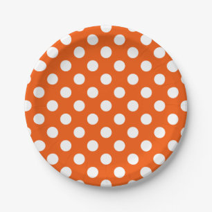 White polka dots on orange paper plate