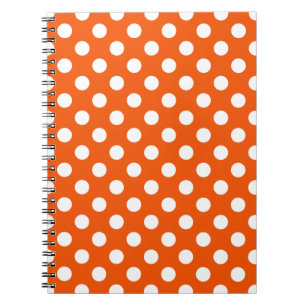 White polka dots on orange spiral notebook