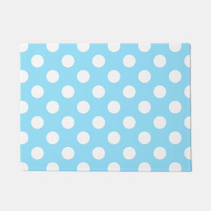 White polka dots on pale blue doormat