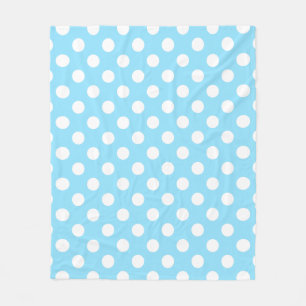 White polka dots on pale blue fleece blanket