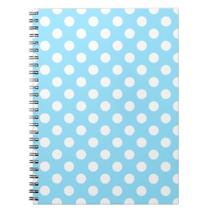 White polka dots on pale blue spiral notebook