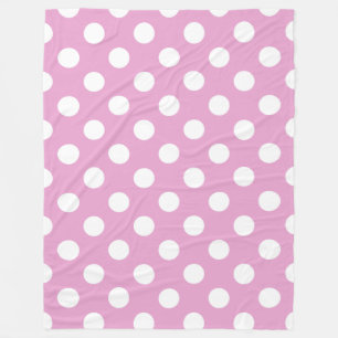 White polka dots on pale pink fleece blanket