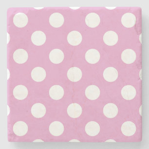 White polka dots on pale pink stone coaster